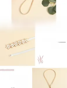 Detail of white flower buckles and golden snake chain for women's elastic belt