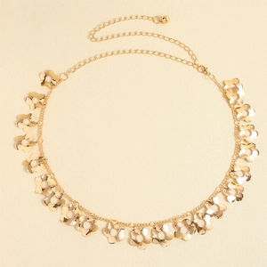 Close-up of golden metal chain belt featuring hollow plum blossom pendants and tassels