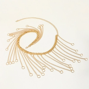 Detailed top view of golden layered tassel body chain with round pendant fringe