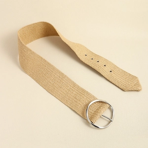 Close-up of khaki woven straw belt with silver round buckle and reinforced metal eyelets