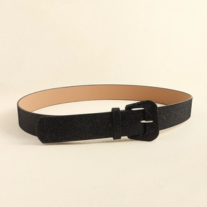 Detail of black glitter Y2K belt with matching square buckle and smooth inner lining