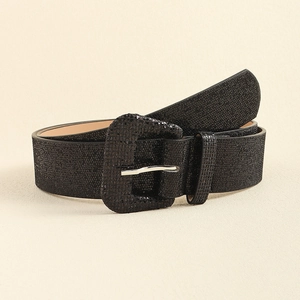 Close-up detail of Y2K style black glitter belt with a rectangular silver metal buckle