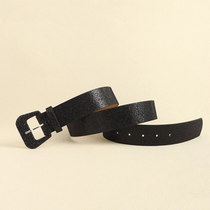 Detail of black Y2K sequined belt featuring a rectangular pin buckle and subtle glitter texture