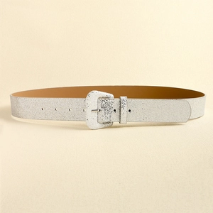 Detail of silver glitter Y2K belt featuring a matching square pin buckle and shiny finish