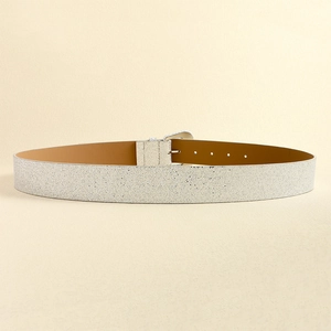 Close-up of glitter sequins on women Y2K fashion belt with silver metal buckle