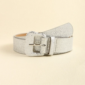 Macro shot of silver sequin y2k belt with glitter texture and square buckle detail