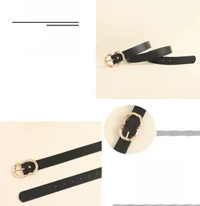 Detail of a thin black leather belt featuring a gold alloy ring buckle and smooth finish