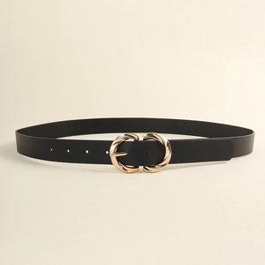 Detail of elegant black leather belt with golden twisted double-ring buckle and needle clasp