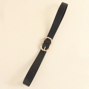 Detail of a thin black PU leather belt featuring a golden double-ring twist buckle