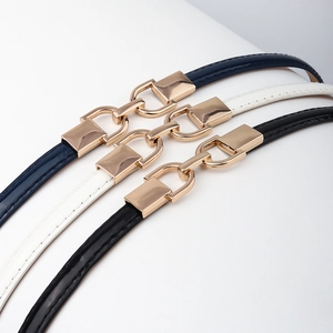 Three elegant adjustable skinny waist belts in navy, white, and black with gold metal buckles
