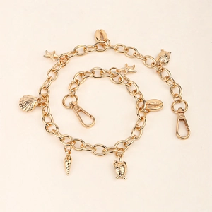 Chaîne de taille dorée thème océan avec pendentifs coquillage, étoile de mer et tortue