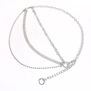 Detail of silver multi-layer metal body chain featuring bead and woven ring links