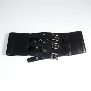 Detail of black elastic wide corset belt featuring three silver pin buckles and eyelets