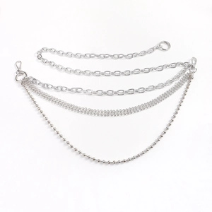 Detail of silver multi-layer metal waist chain with ball links and lobster clasps