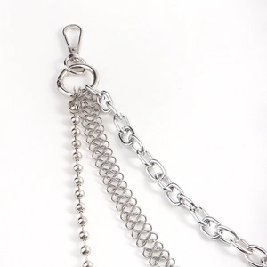 Detail of silver multi-layer metal waist chains with ball, woven, and thick links