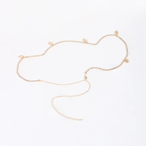 Golden waist body chain with rhinestone claw links and leaf charms for beach bikini styling