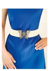 Detail of elastic waist belt with hollow butterfly metal buckle on blue dress