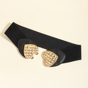 Women's wide elastic belt with gold heart-shaped metal buckle on cream background
