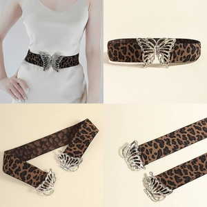 Detail of leopard print elastic waist belt featuring a silver butterfly metal buckle