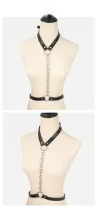 Macro view of sexy black leather body chain with silver metal rings and heavy chains