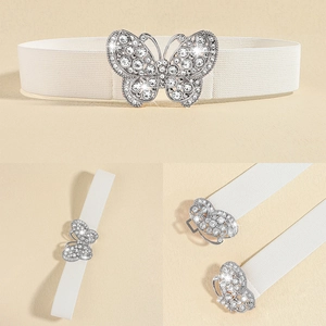 Close-up of white elastic waist belt featuring a sparkling silver rhinestone butterfly buckle