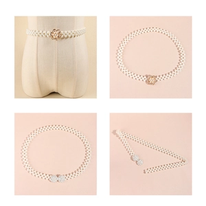 Detail of elegant pearl waist chain featuring rhinestone flower and butterfly buckles