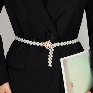 Elegant pearl waist chain with square rhinestone buckle on a black blazer for women