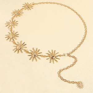 Detailed close-up of golden sunflower metal waist chain with smiling face charms