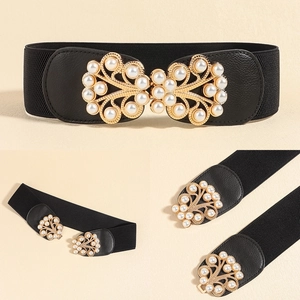 Detailed view of the vintage gold pearl buckle on this wide elastic waist belt for women
