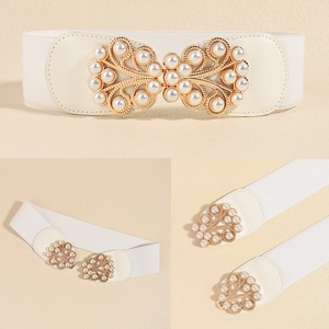 Detail of white elastic waist belt with gold floral buckle and pearls for women