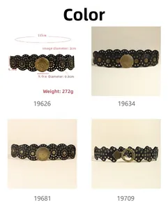 Detail view of Western style wide leather belts with vintage baroque metal buckles