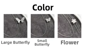 Détails de la ceinture ajustable en maille argentée avec pendentifs papillon et fleur