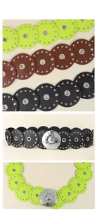 Detail of punk style PU leather disc belt with metal rivets and grommets in three colors