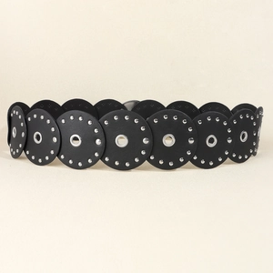 Detail of western waste-style belt showing round PU leather discs and silver metal rivets