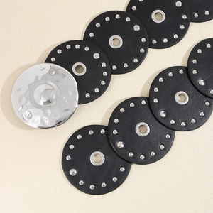 Detail of western waste style PU belt featuring silver studs and hammer texture metal discs