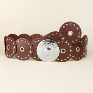 Close-up of western style PU leather belt with round patches and metal rivet studs