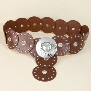 Close-up of vintage PU leather waist belt with silver eyelet rivets and hammered round buckle