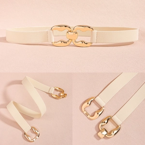 Detail of beige elastic waist belt with gold interlocking metal geometric buckle