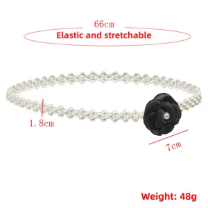 Detail of white pearl elastic waist chain with a black camellia flower and size specs