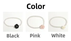 Detailed comparison of camellia pearl chain belts in black, pink, and white color options