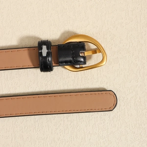 Slim minimalist leather belt for women featuring an irregular matte gold heart buckle