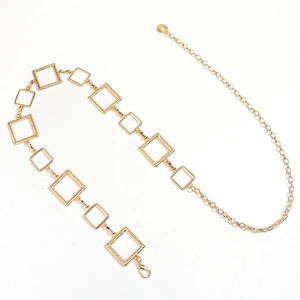 Detailed view of the gold geometric square link chain with textured surface and lobster clasp