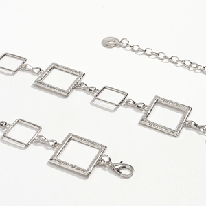 Silver square link metal waist chain with textured hollow geometric charms for dresses