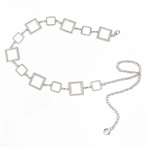 Detail of silver metal waist chain showing geometric square links and lobster clasp