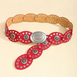 Detailed view of bohemian red leather belt with vintage floral embossed silver buckle