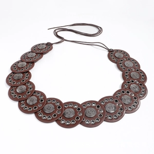 Ethnic wide waist belt with bohemian leather discs and vintage metal embossed charms