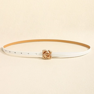 Detail of white leather belt with a golden rose flower buckle and adjustable metal eyelets