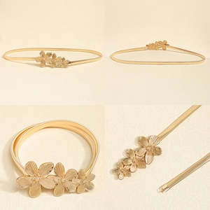 Detail der goldenen Feder-Taillenkette mit eleganten strukturierten Blumen für Kleider