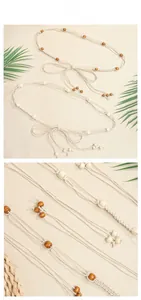 Macro detail of bohemian hand-woven waist chain with wooden beads and tassel accents