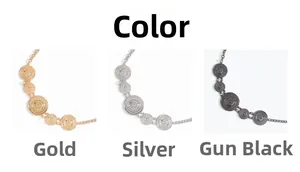 Detailed view of sun motif metal chain belts in gold, silver, and gun black finishes